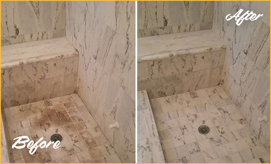 Before and After Picture of a Dirty Flatiron District Marble Shower Cleaned to Eliminate Dark Stains